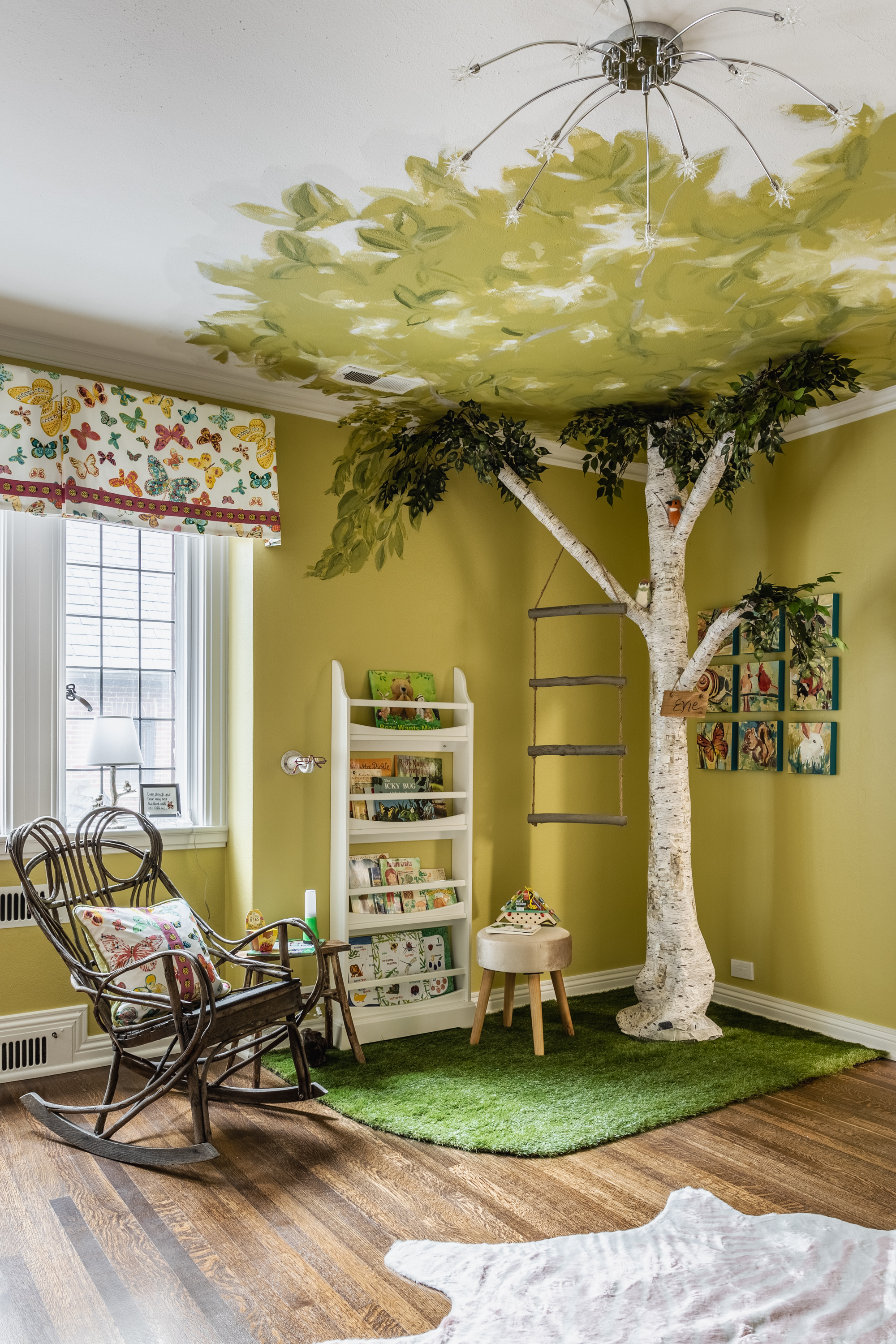 Maryellen Hodapp and Christy Soldatis of Sassy Green Interiors made this child’s bedroom a not-so-secret garden year-round. Carpeting only this corner of the room separates the play area from the sleep area—important in a little one’s bedroom. The Monet Rocking Chair has a fanciful-organic vibe similar to that of the rocker here.
